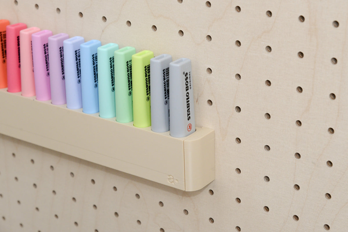 Close-up of the wall highlighter holder for pegboard with pastel highlighters - Aire