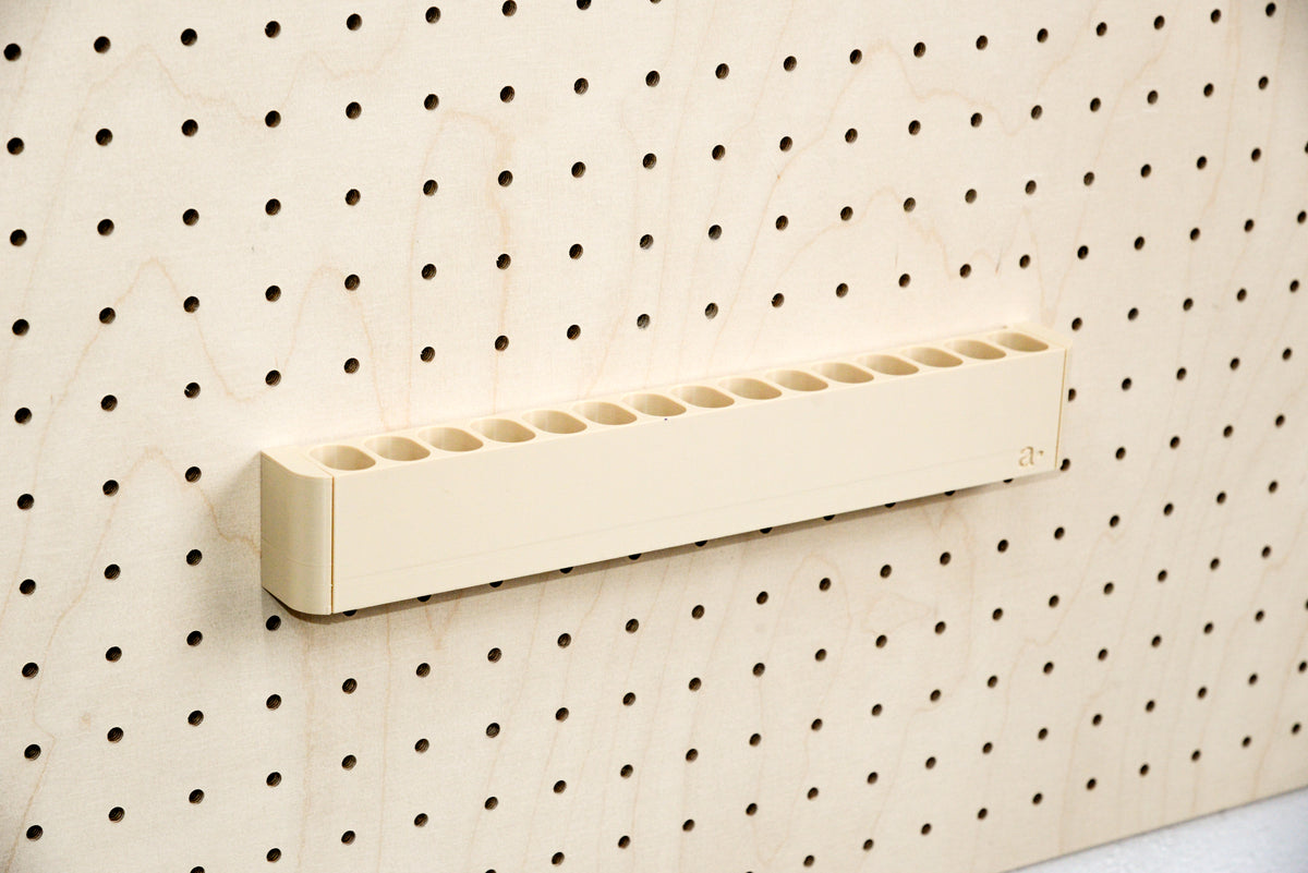 Empty pegboard highlighter holder with 15 3D-printed slots - Aire