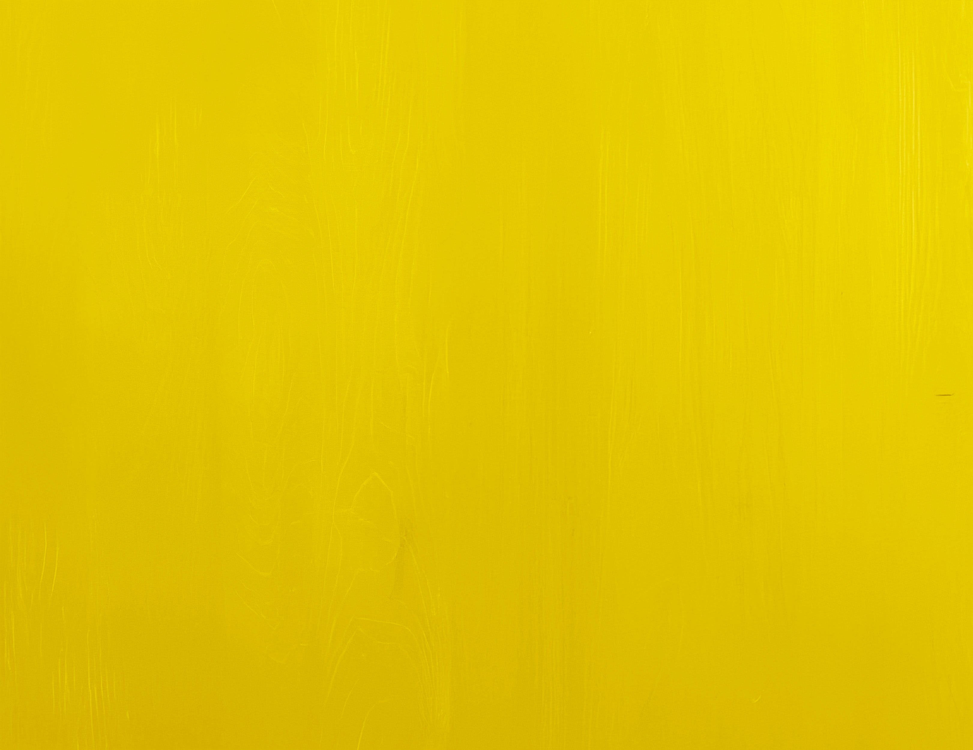 Bright yellow wooden textured surface with subtle grain patterns and smooth finish for stylish wall organizer background